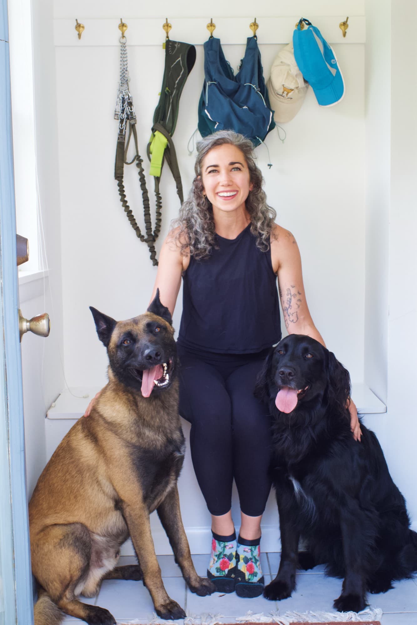 Tarah Romano with her two dogs at her Arlington training studio